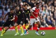 Britain Football Soccer - Arsenal v Manchester City - Premier League - Emirates Stadium - 2/4/17 Manchester City's David Silva in action with Arsenal's Alex Iwobi Reuters / Eddie Keogh Livepic