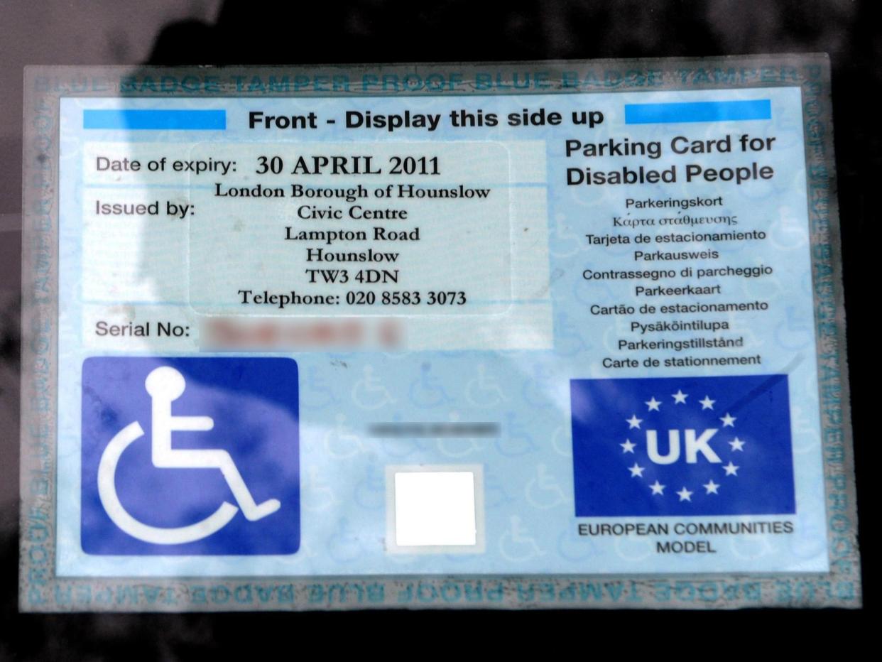 Blue badges allow people to use designated spaces closer to entrances: PA