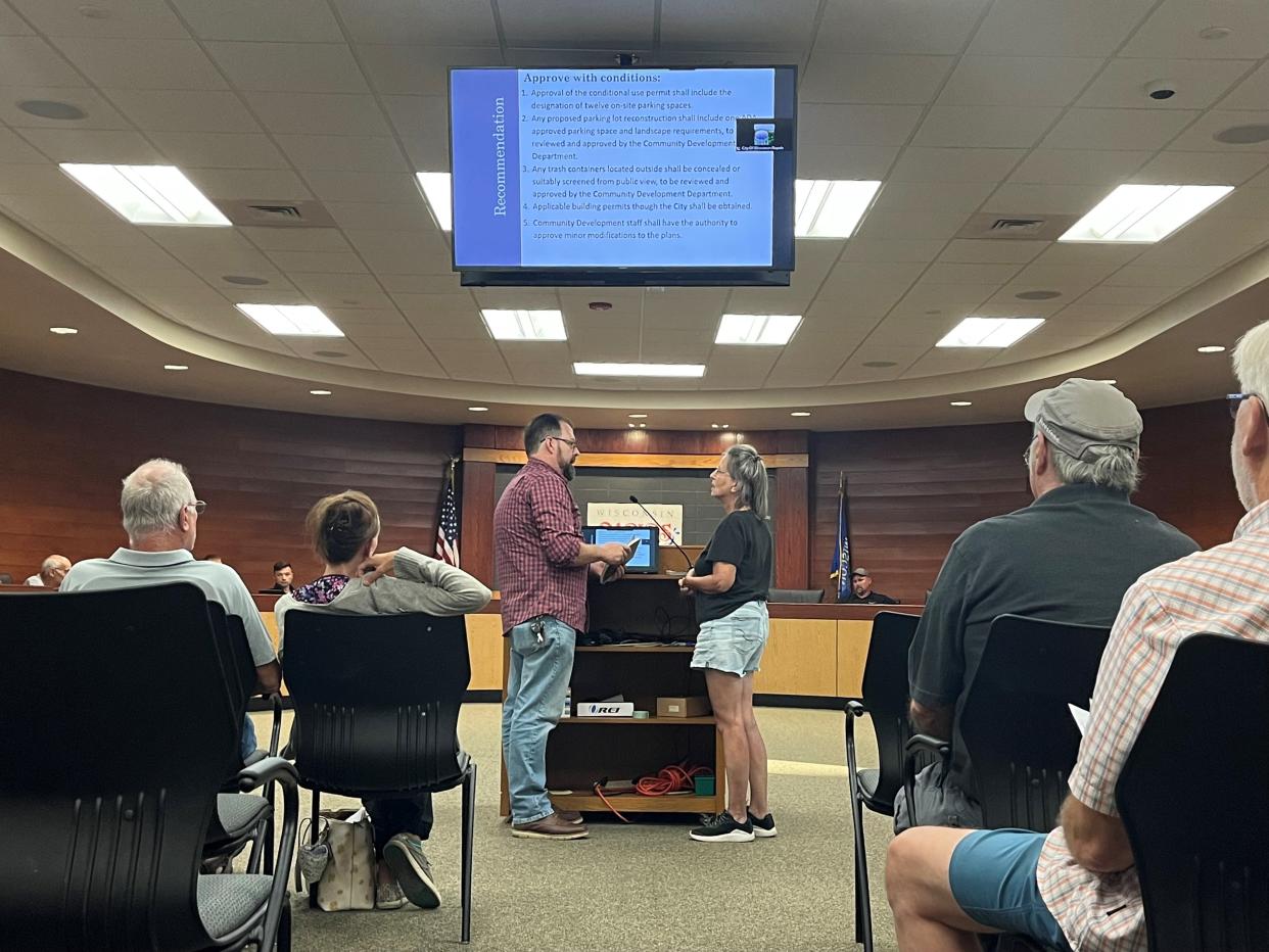 Wisconsin Rapids resident Alison Gaskill asks Jim Joyce, the president of the board of Mary's Place, if taxpayers are responsible for paying for supplies, utilities and operations at Mary's Place.