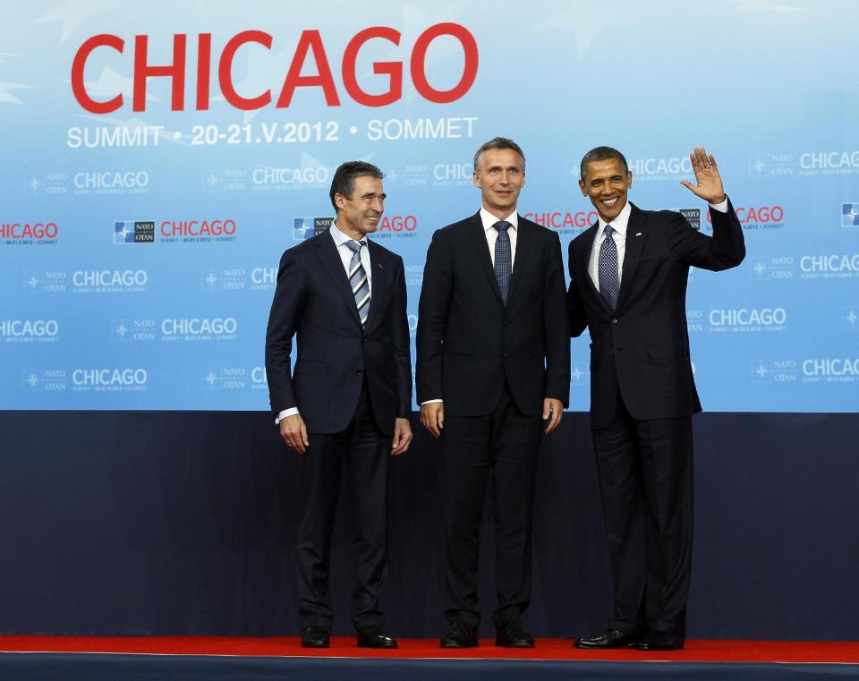 FILE - In this Sunday May 20, 2012 filephoto, Norway's Prime Minister Jens Stoltenberg, center, poses with NATO Secretary General Anders Fogh Rasmussen, left, and U.S. President Barack Obama on his arrival at the NATO summit in Chicago. NATO announced on Friday, March 28, 2014 that former Norwegian Prime Minister Jens Stoltenberg will become chief of the NATO alliance when current NATO Secretary General Anders Fogh Rasmussen steps down in the autumn of 2014. (AP Photo/Carolyn Kaster, file)
