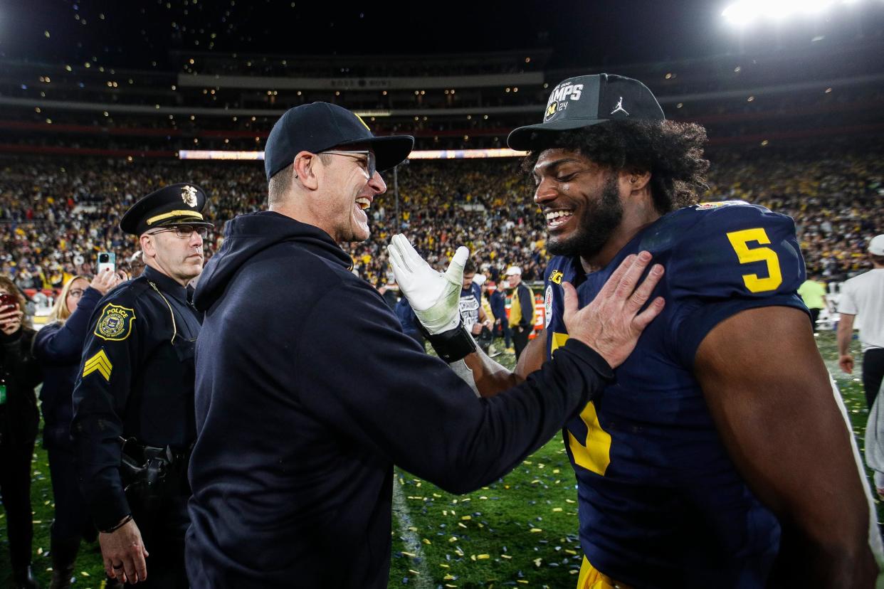 Michigan head coach Jim Harbaugh celebrates with defensive end Josaiah Stewart (5) after a 27-20 Rose Bowl win over Alabama at the 2024 Rose Bowl in Pasadena, Calif., on Monday, Jan. 1, 2024.