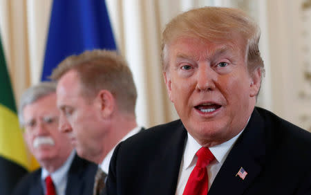 U.S. President Donald Trumps, seated with acting Defense Secretary Patrick Shanahan (C) and National Security adviser John Bolton speaks during a meeting with the leaders of The Bahamas, the Dominican Republic, Haiti, Jamaica and Saint Lucia at his Mar-a-Lago estate in Palm Beach, Florida, U.S., March 22, 2019. REUTERS/Kevin Lamarque