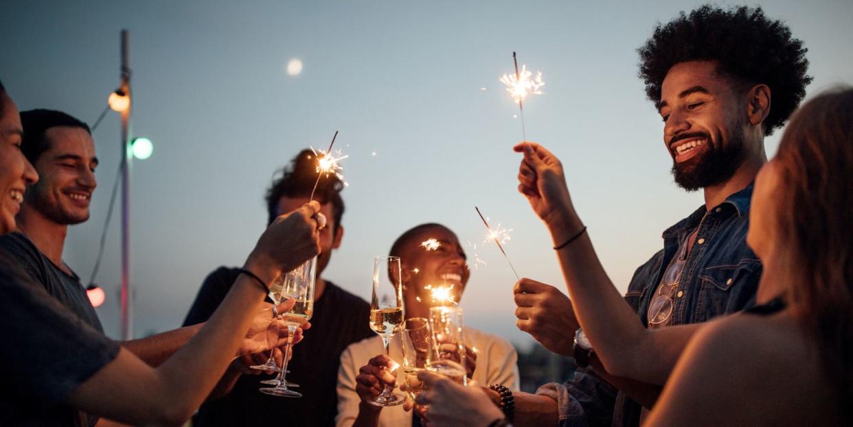 friends celebrating at party on rooftop