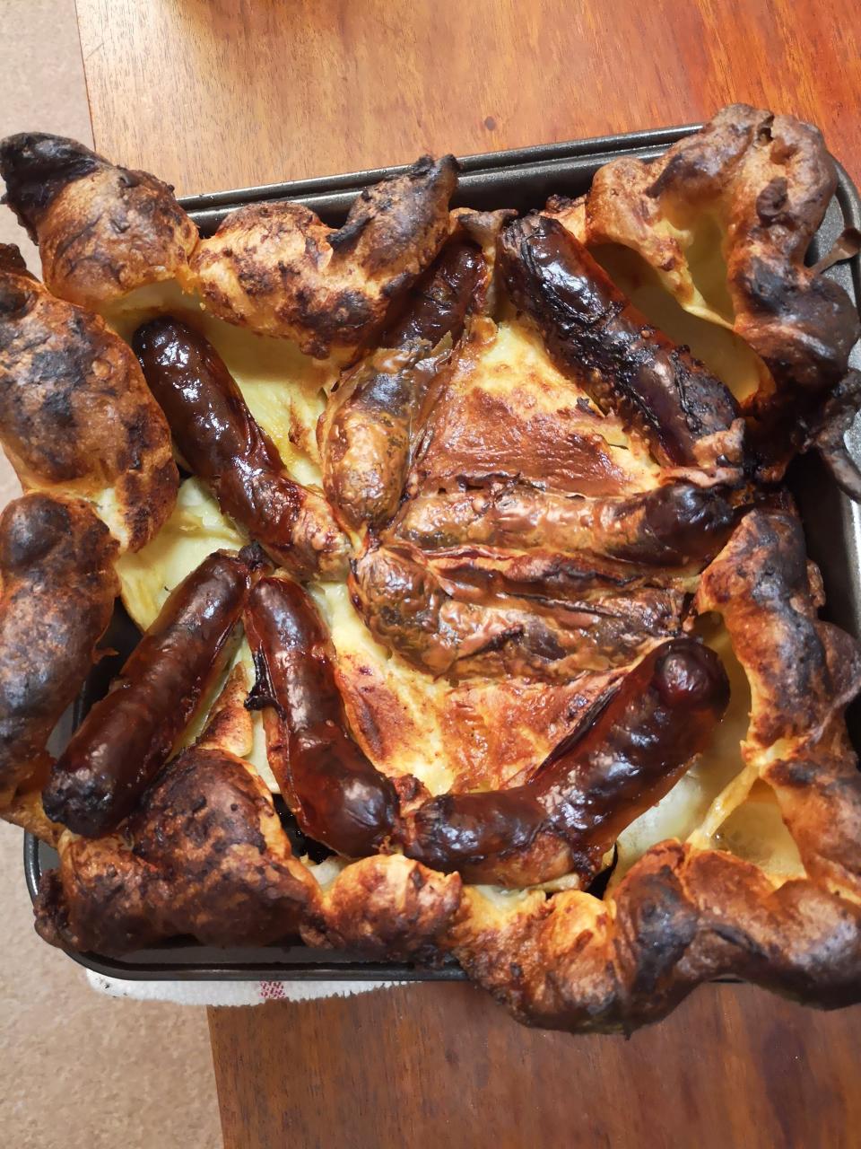 toad in the hole dish with sausages coming out