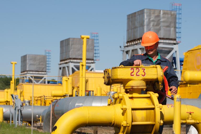 An employee tightens the valve on a pipeline at the Bilche-Volytsko-Uherske underground gas storage facility in the Lviv region of western Ukraine, on May 21, 2014