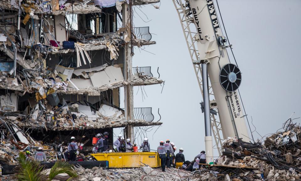 Rescuers continue to search through the rubble  of the Champlain Towers south condo collapse in Surfside, Fla. on Tuesday, June 29, 2021.