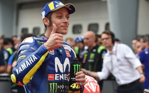 ovistar Yamaha MotoGP's Italian rider Valentino Rossi celebrates after the qualifying session of the Malaysia MotoGP at the Sepang International Circuit in Sepang on November 3, 2018. (Photo by Mohd RASFAN / AFP)MOHD RASFAN/AFP/Getty Images - Credit: Mohd RASFAN/AFP