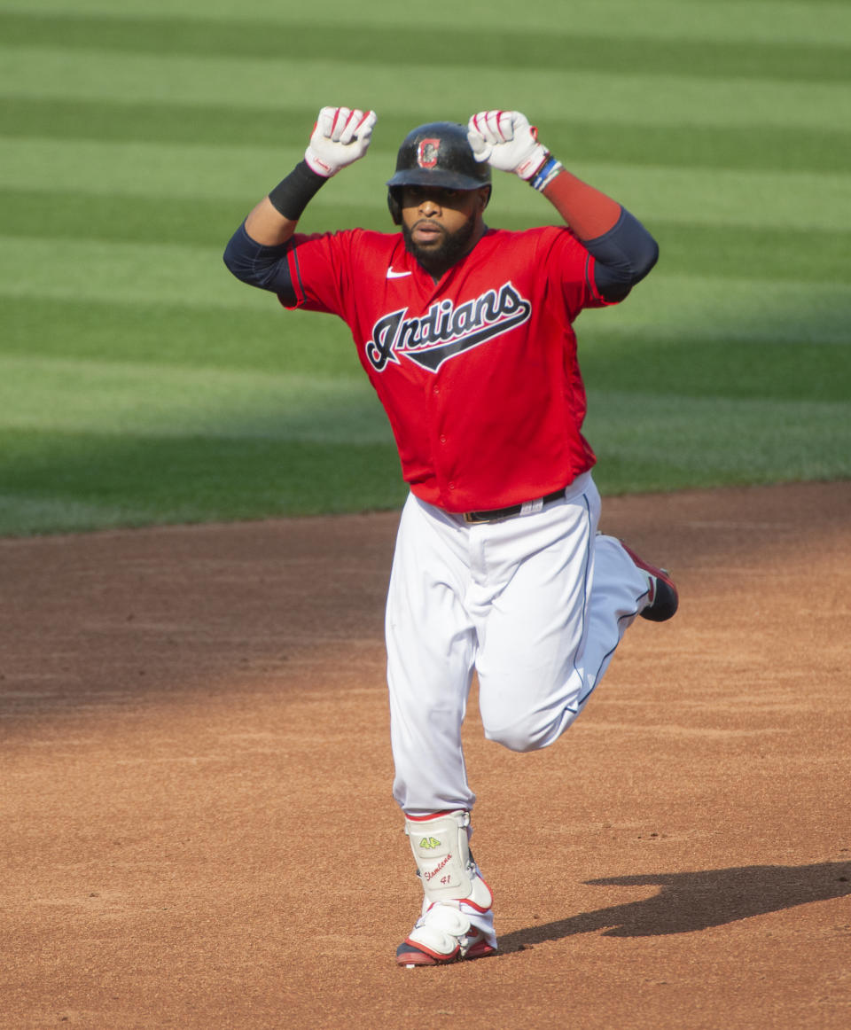 Cleveland Indians' Carlos Santana celebrates after hitting a two-run home run off Pittsburgh Pirates starting pitcher JT Brubaker during the third inning of a baseball game in Cleveland, Sunday, Sept. 27, 2020. (AP Photo/Phil Long)