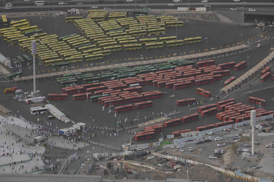 Pilgrim buses line up during the annual Hajj pilgrimage in Mecca, Saudi Arabia, Tuesday, June 11, 2024. (AP Photo/Rafiq Maqbool)