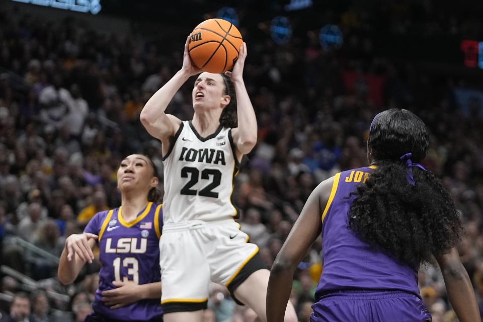 Iowa's Caitlin Clark shoots past LSU's Last-Tear Poa during the first half of the NCAA Women's Final Four championship basketball game Sunday, April 2, 2023, in Dallas. (AP Photo/Darron Cummings)