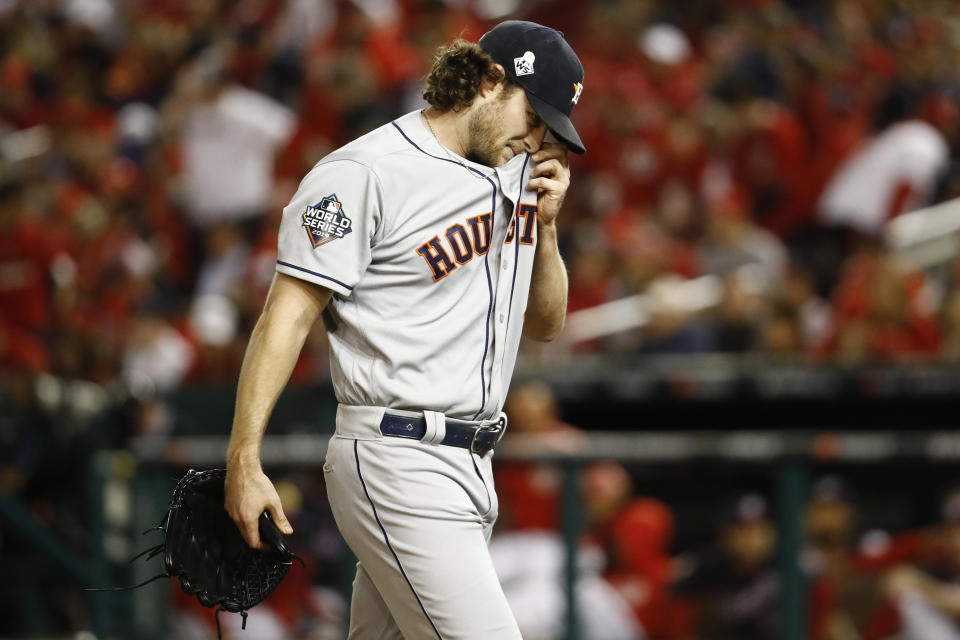 Houston Astros starting pitcher Gerrit Cole walks to the dugout after the third inning of Game 5 of the baseball World Series against the Washington Nationals Sunday, Oct. 27, 2019, in Washington. (AP Photo/Patrick Semansky)