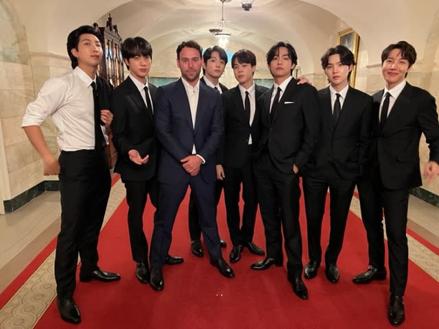 Hybe board member, Scooter Braun poses with BTS at The White House on Tuesday, May 31. - Credit: Shauna Nep