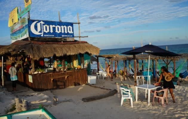 The Coconut Cabana, a beach bar on the island of Cozumel that looks straight out of a Corona commercial.