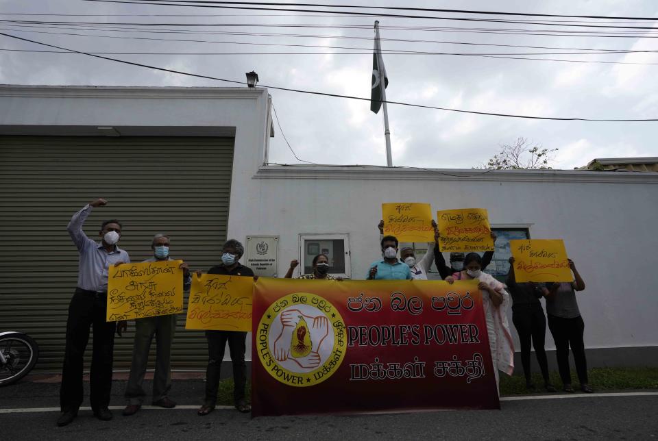 Members of Sri Lankan civil society organisations protest demanding justice for the Sri Lankan employee who has been lynched by Muslim mob in Sialkot last week outside Pakistani high commission in Colombo, Sri Lanka, Monday, Dec. 6, 2021. (AP Photo/Eranga Jayawardena)