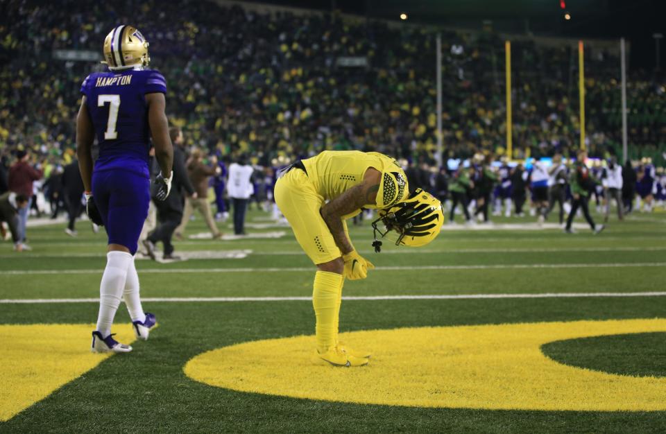 Oregon's Kris Hutson remains in the end zone after time ran out for the Ducks on a last second Hail Mary pass by Bo Nix against Washington Saturday, Nov. 12, 2022, at Autzen Stadium in Eugene, Ore.