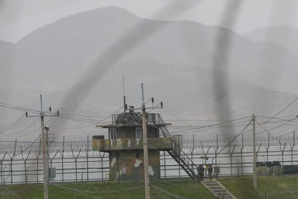 South Korean army soldiers gather under a military post in Paju, South Korea, near the border with North Korea, Thursday, April 13, 2023. North Korea on Thursday conducted its first intercontinental ballistic missile launch in a month, possibly testing a new type of more mobile, harder-to-detect weapons system, its neighbors said, in an extension of the North's provocative run of missile tests. (AP Photo/Ahn Young-joon)