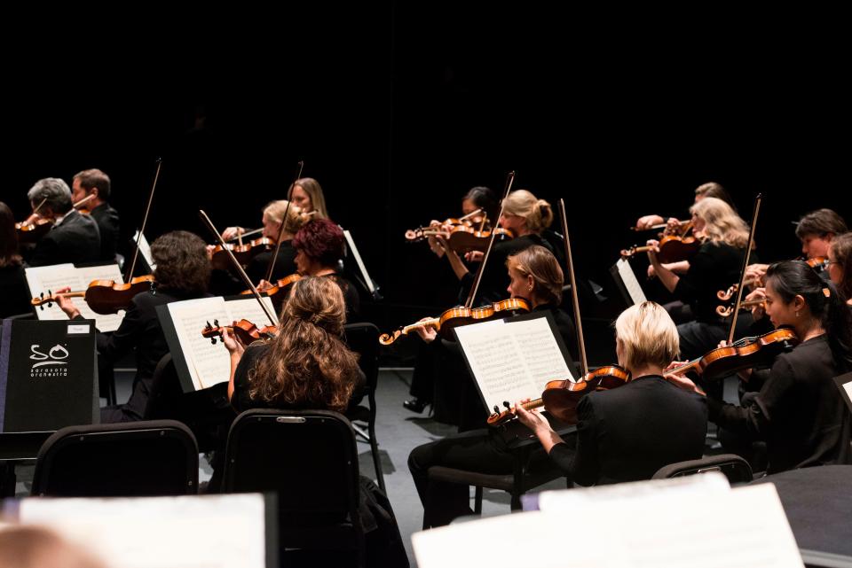 Sarasota Orchestra musicians in concert. The organization is working on plans to build a new music center and concert hall for its programs.