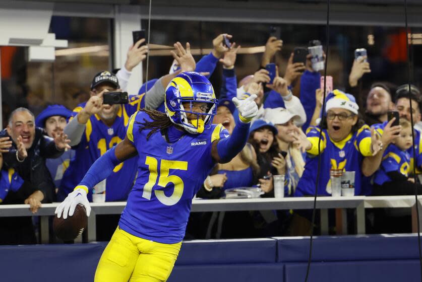 Rams receiver Demarcus Robinson celebrates his touchdown catch against the Saints just before the half.