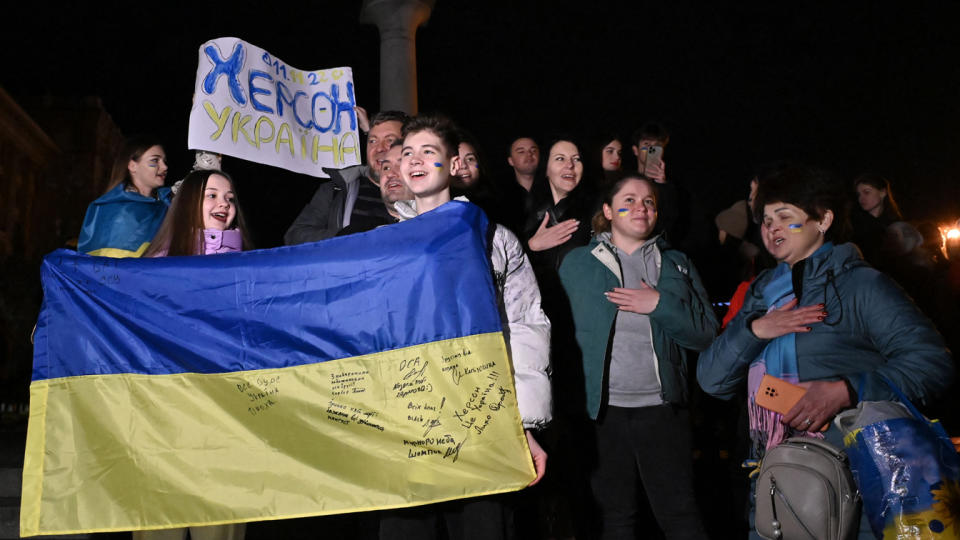 Ukrainians celebrate the liberation of Kherson in Kyiv, on Friday