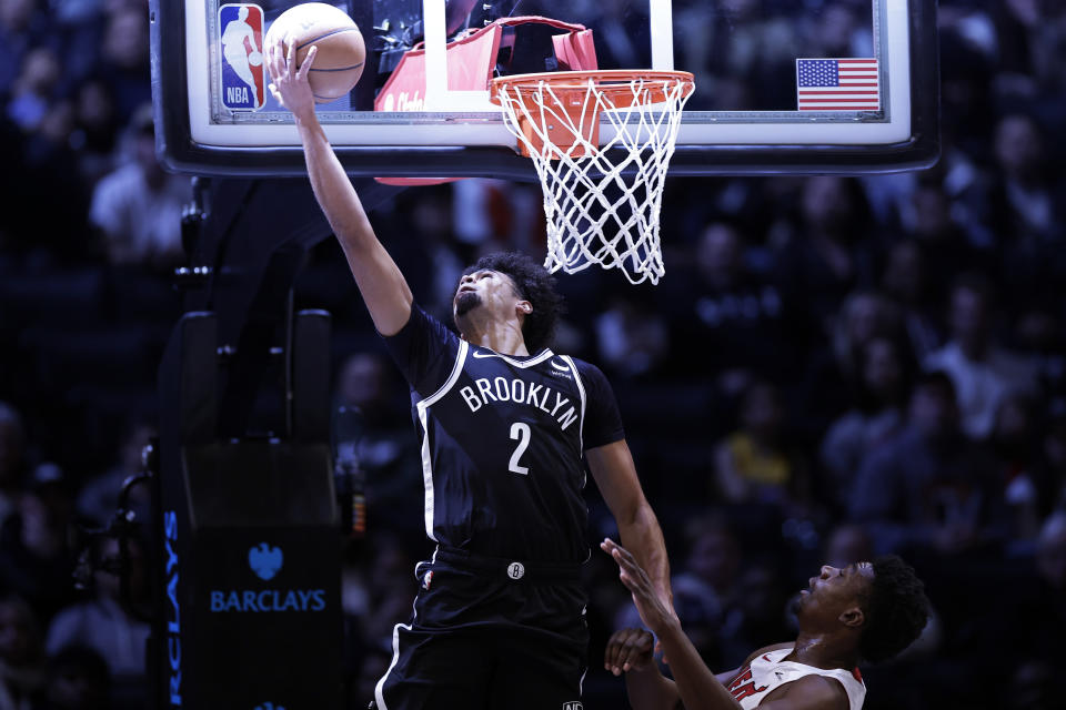 Brooklyn Nets forward Cameron Johnson drives to the basket against the Miami Heat during the first half of an NBA basketball game Saturday, Nov. 25, 2023, in New York. (AP Photo/Adam Hunger)