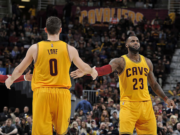 LeBron James and Kevin Love make their Mavs mark. (Getty Images)