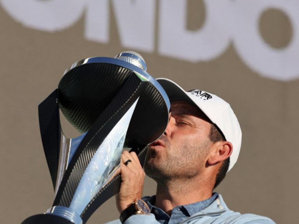Charles Schwartzel celebrates with the trophy (AFP via Getty Images)