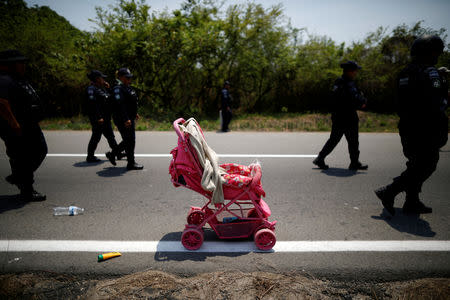 FILE PHOTO: A stroller abandoned by Central American migrants is seen after an immigration raid in their journey towards the United States, in Pijijiapan, Mexico April 22, 2019. REUTERS/Jose Cabezas/File Photo