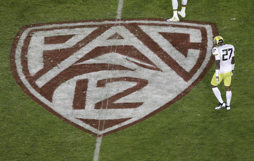 Oregon defensive back Terrance Mitchell (27) walks next to a Pac-12 logo on the field at Stanford Stadium during an NCAA college football game against Stanford in Stanford, Calif., Thursday, Nov. 7, 2013. (AP file photo)