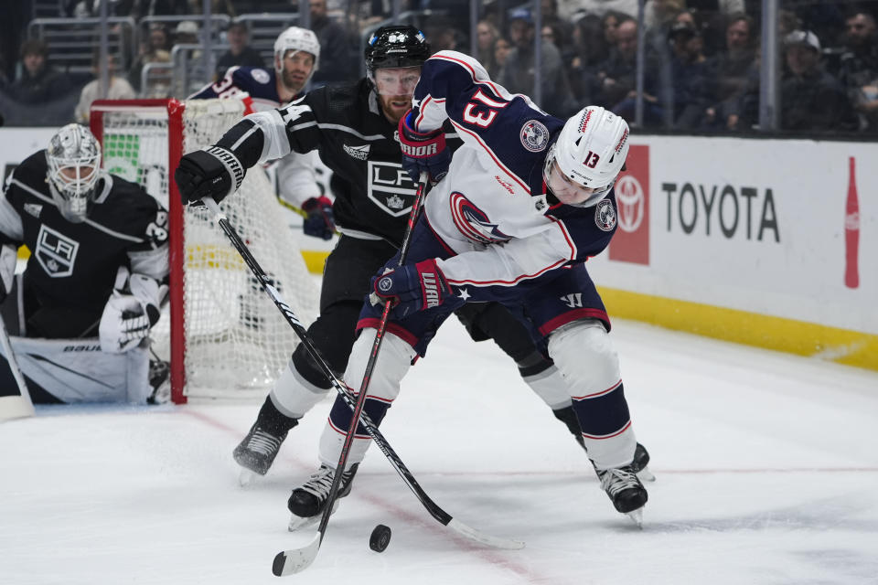 Columbus Blue Jackets left wing Johnny Gaudreau, right, controls the puck against Los Angeles Kings defenseman Vladislav Gavrikov during the first period of an NHL hockey game Tuesday, Feb. 20, 2024, in Los Angeles. (AP Photo/Ryan Sun)