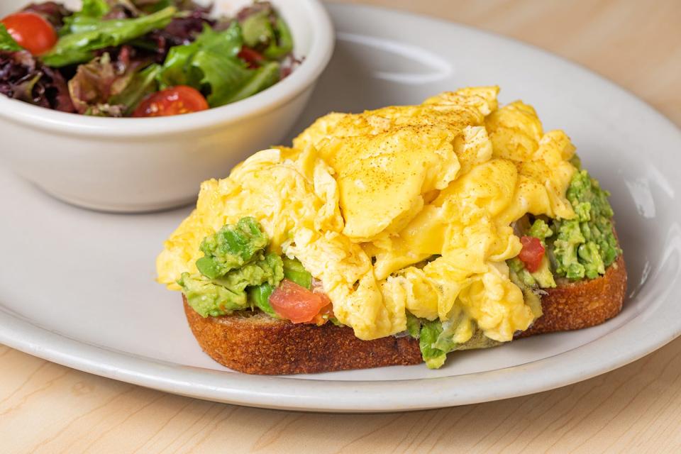 Houston-based restaurant The Toasted Yolk Cafe, serving brunch dishes such as the avocado toast topped with eggs pictured here, has opened a Bradenton location after opening a Sarasota spot last year.