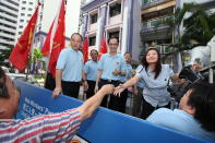 Resident shaking the hands of WP's Lee Li Lian.