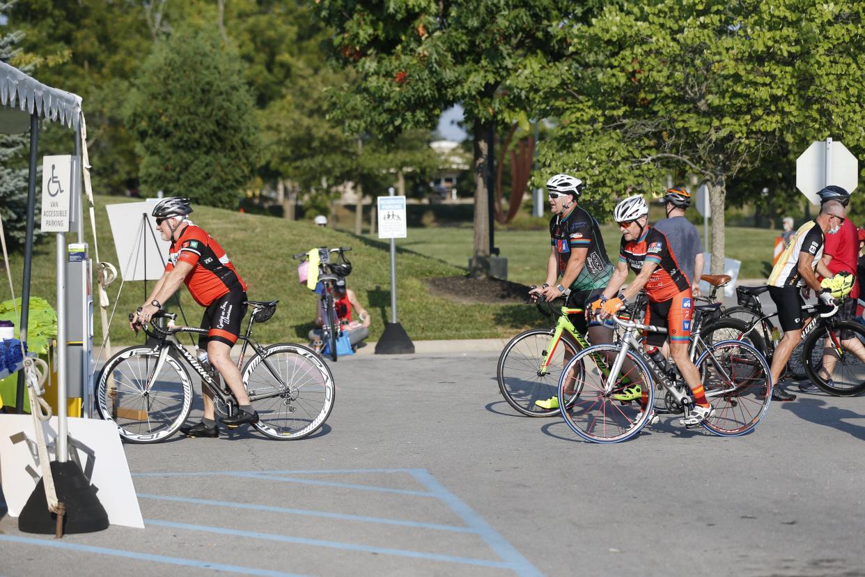 Participants in ReidRide 13 gather at the start of the event on Saturday, Aug. 21, 2021.