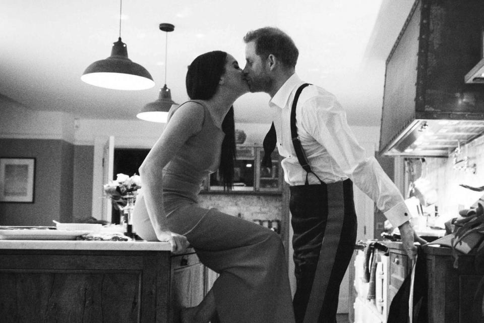 The Duke and Duchess of Sussex kissing in a kitchen. The picture is part of a trailer for a new documentary called ‘Harry and Meghan’ – the Sussexes’ behind the scenes (Duke and Duchess of Sussex/Netflix/PA) (PA Media)