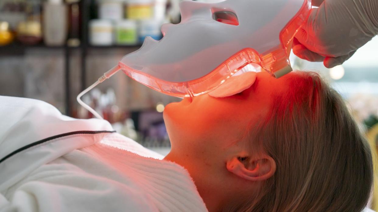 led mask treatment applied to a person in doctor's office