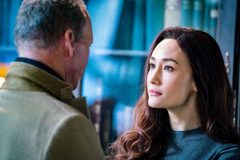 Of all the rare book stores in all the towns in all the world, Rembrandt (Michael Keaton) walks into one owned by assassin Anna (Maggie Q) in "The Protege."