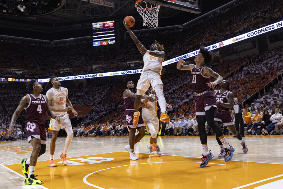 Tennessee guard Jahmai Mashack (15) shoots over Texas A&M forward Andersson Garcia (11) during the second half of an NCAA college basketball game Saturday, Feb. 24, 2024, in Knoxville, Tenn. (AP Photo/Wade Payne)