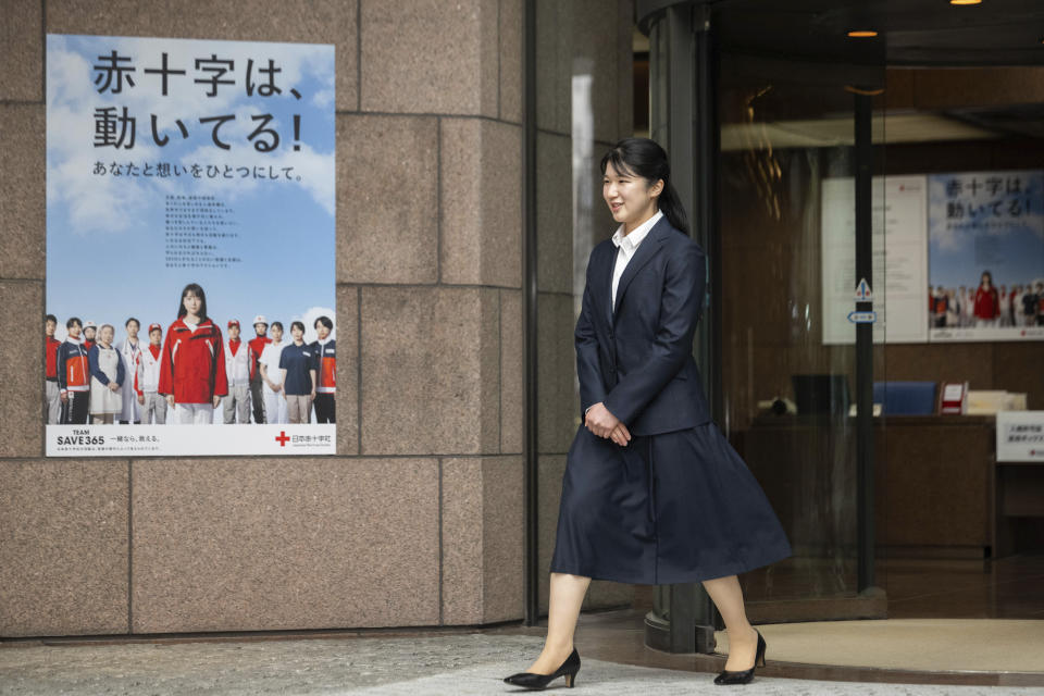 Japan's Princess Aiko, the daughter of Emperor Naruhito and Empress Masako, walks out of the gate of the Japanese Red Cross Society as she begins to work on Monday, April 1, 2024. (Yuichi Yamazaki/Pool Photo via AP)