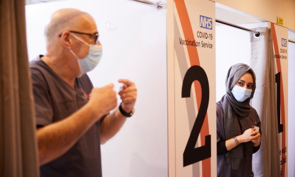 Pharmacists Peter Marks and Rohina Arshad at work at the vaccination centre