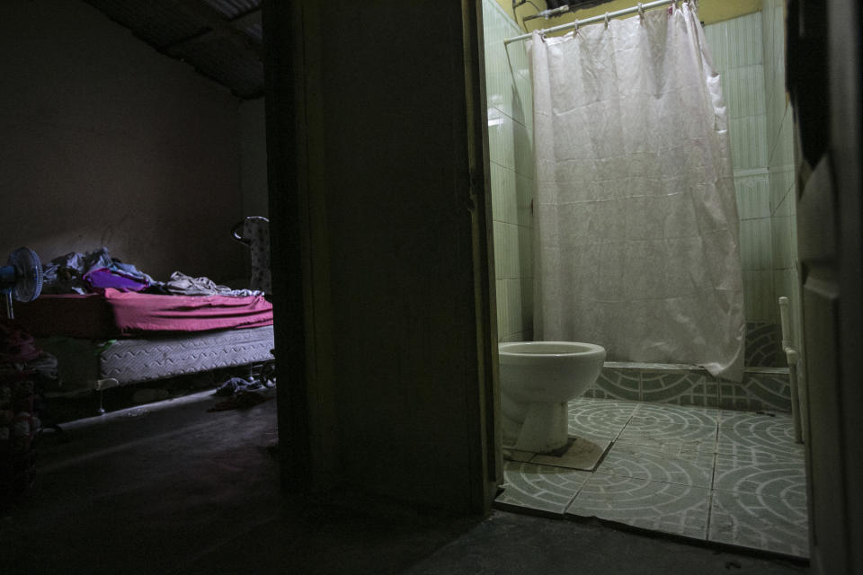 A view of the bedroom and bathroom of a woman who said she aborted here in an undisclosed town in northern Honduras, Friday, March 10, 2023. The woman, who does not want to be identified because abortion is illegal in Honduras under all circumstance, said she took abortion pills five years ago and evacuated into her toilet, hours after taking them. (AP Photo/Ginnette Riquelme)