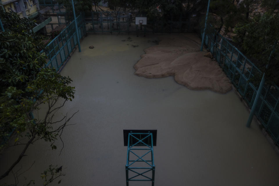 A flooded playground is seen following heavy rainstorms in Hong Kong, Friday, Sept. 8, 2023. (AP Photo/Louise Delmotte)