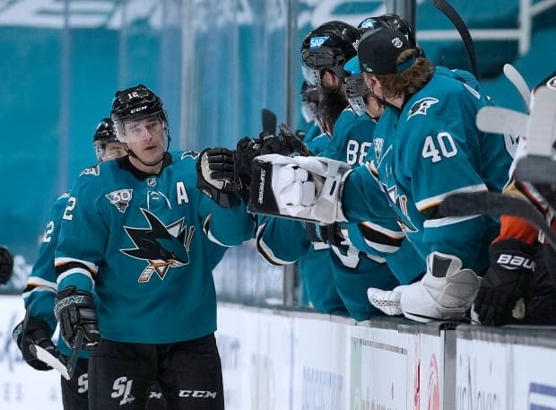 San Jose Sharks centre Marleau, left, is congratulated by teammates after scoring a goal against the Anaheim Ducks during the second period of an NHL hockey game on April 6 in San Jose, Calif.