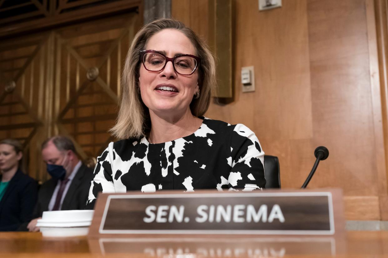 Sen. Kyrsten Sinema, D-Ariz., arrives for a meeting of the Senate Homeland Security Committee at the Capitol in Washington, Wednesday, Aug. 3, 2022.