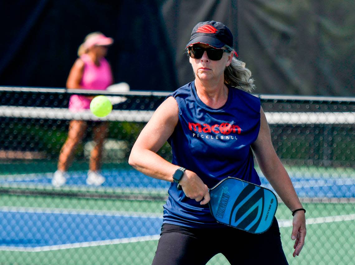 Maryann Bates returns a backhand while playing pickleball at the Tattnall Square Pickleball Center in Macon. Jason Vorhees/The Telegraph