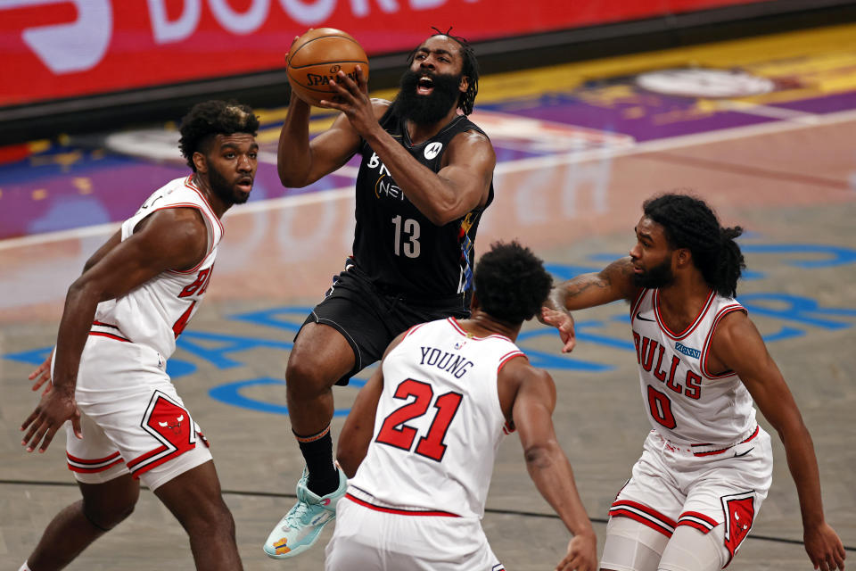 Brooklyn Nets guard James Harden (13) drives to the basket past Chicago Bulls forward Thaddeus Young during the second half of an NBA basketball game Saturday, May 15, 2021, in New York. (AP Photo/Adam Hunger)