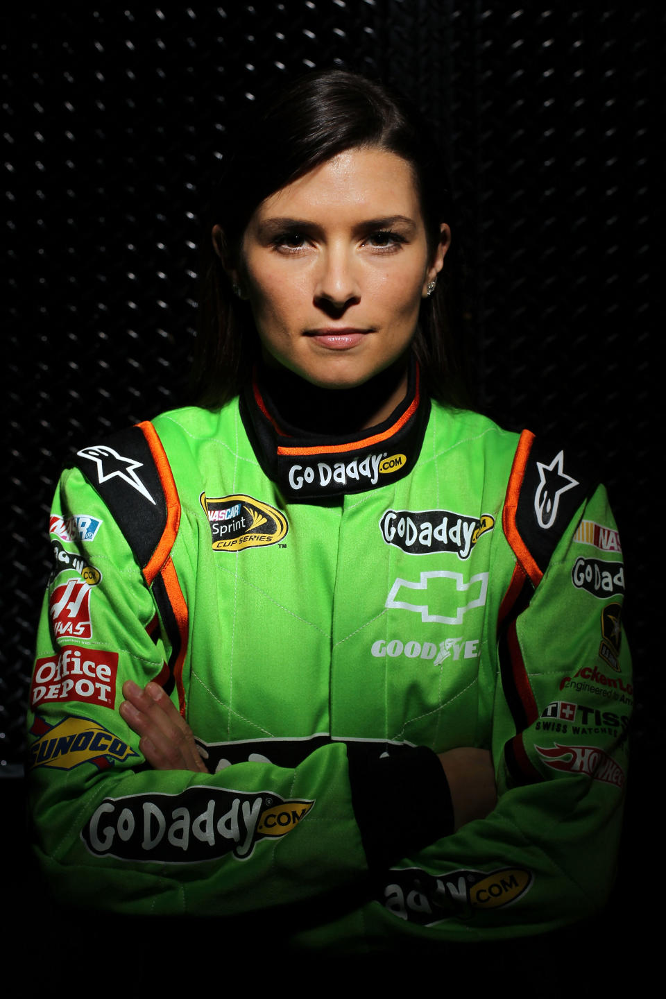 DAYTONA BEACH, FL - FEBRUARY 16: Danica Patrick, driver of the #7 GoDaddy.com Chevrolet, poses during NASCAR Media Day at Daytona International Speedway on February 16, 2012 in Daytona Beach, Florida. (Photo by Jamie Squire/Getty Images for NASCAR)