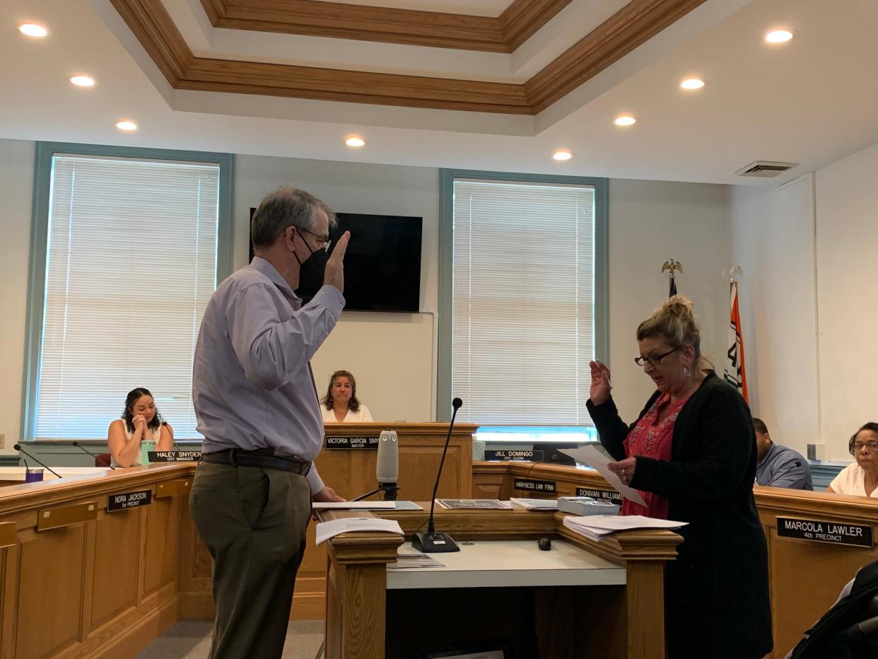 Andrew French, left, is sworn in as a member of the Albion City Council by Clerk Jill Domingo Monday, May 17.