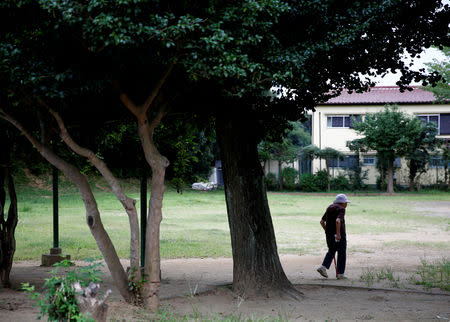 A resident takes a walk at a park at Sennari district in Sakura, Chiba Prefecture, Japan, August 28, 2018. Picture taken August 28, 2018. REUTERS/Kim Kyung-Hoon