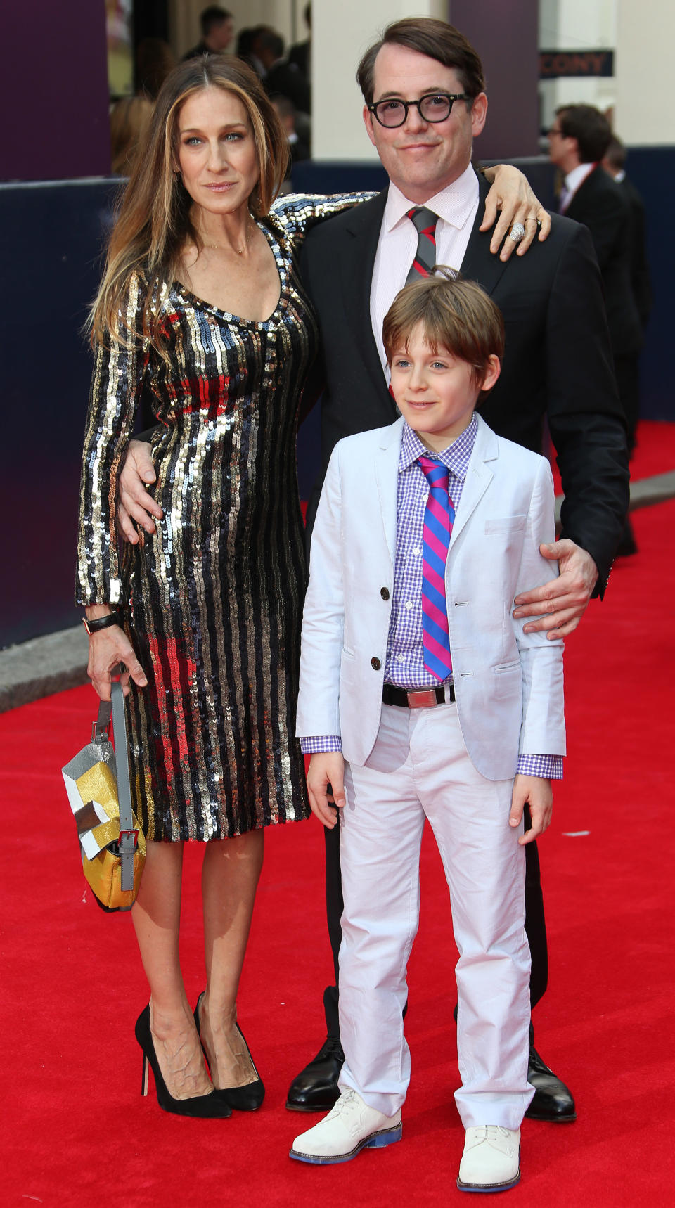 Sarah Jessica Parker, husband Matthew Broderick and their son James, arrive for the opening night of Charlie and the Chocolate Factory, a new stage musical based on Roald Dahl's popular story about Willy Wonka and his amazing Chocolate Factory, at the Drury Lane Theatre in central London, Tuesday, June 25, 2013. (Photo by Joel Ryan/Invision/AP)