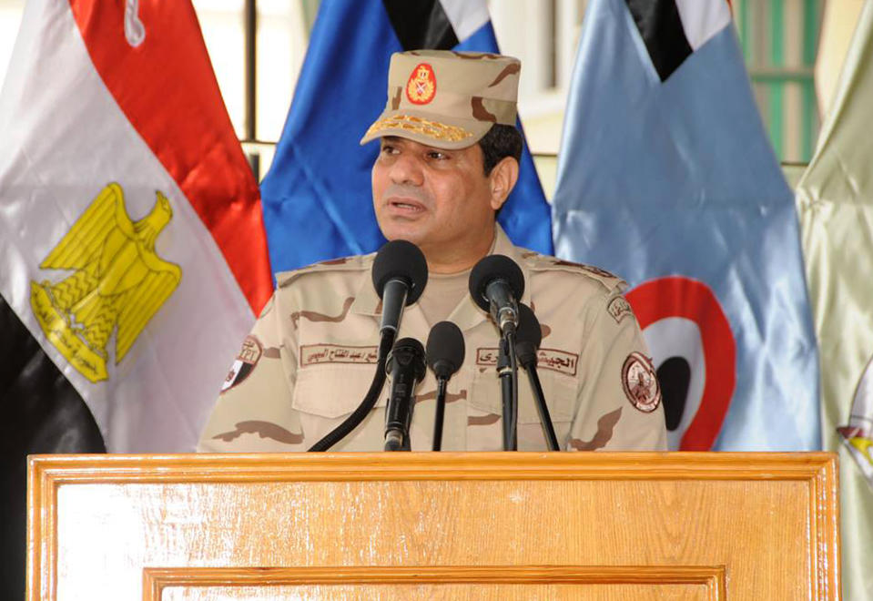 This image posted on the official Facebook account of Egypt's military spokesman shows Field Marshal Abdel-Fattah el-Sissi addressing cadets at a military academy in Cairo, Egypt, Tuesday, March 4, 2014. He gave his strongest indication yet that he intends to enter presidential elections, saying in the speech that he "can't turn his back" if Egyptians want him to run. (AP Photo/Egypt military spokesman via Facebook)