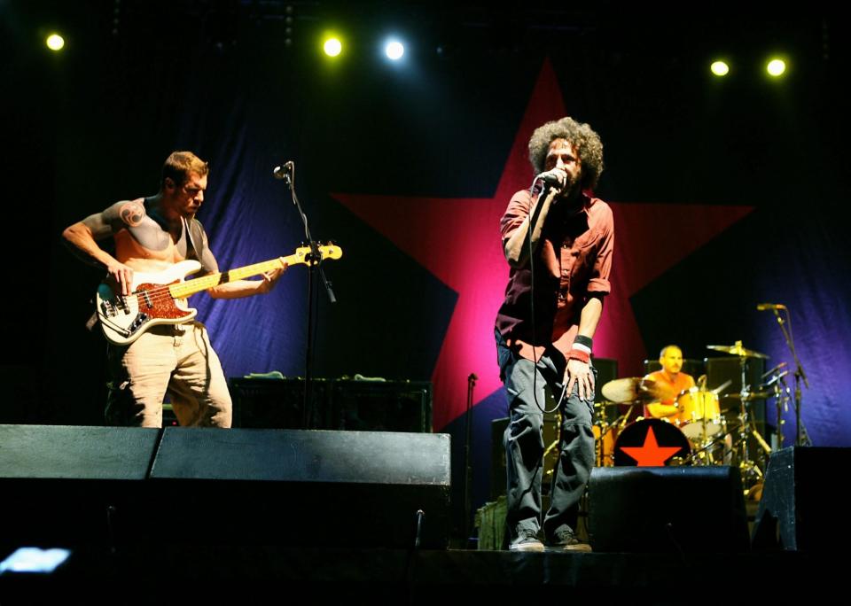 INDIO, CA - APRIL 29: (L-R) Musicians Tim Commerford, Zack De La Rocha and Brad Wilk from the band "Rage Against the Machine" perform during day 3 of the Coachella Music Festival held at the Empire Polo Field on April 29, 2007 in Indio, California. (Photo by Trixie Textor/Getty Images)